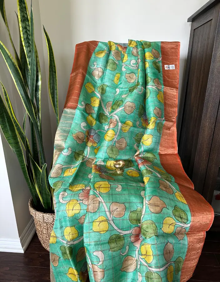 Green Tussar Jamdani Saree with Multicolor Handwoven Leaf Motifs and Copper Border Green Tussar Jamdani Saree with Multicolor Handwoven Leaf Motifs and Copper Border